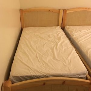 Two beige twin frames & two twin mattress